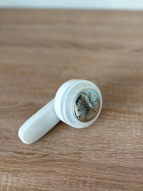 CocoonRevive Electric Lint Remover - front view showing stainless steel cutting head